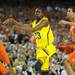 Michigan freshman Caris LeVert passes the ball around Syracuse sophomore Michael Carter-Williams during the second half at the Final Four in Atlanta on Saturday, April 6, 2013. Melanie Maxwell I AnnArbor.com